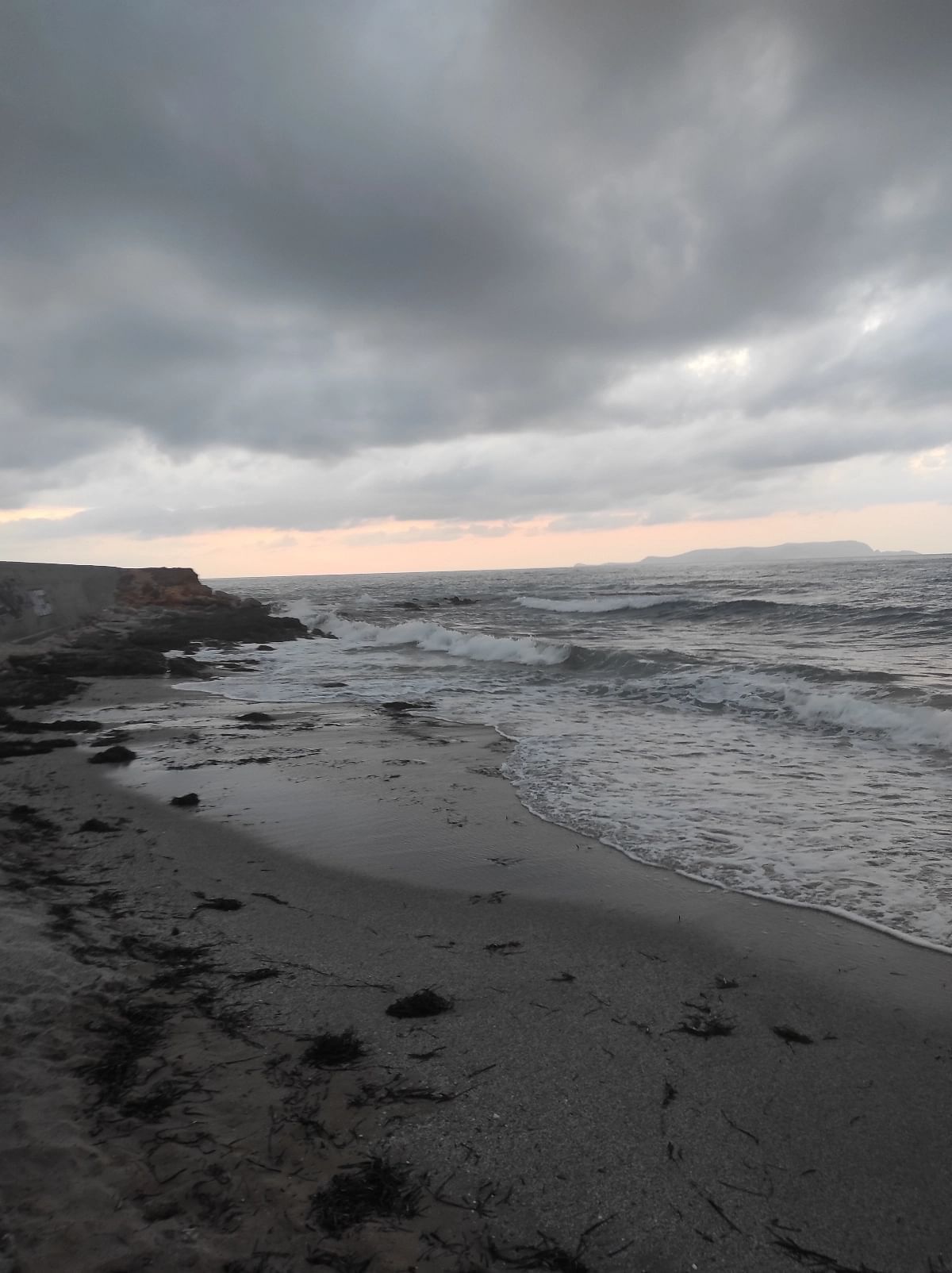 Kato Gouves beach in November. In November, a picturesque sight can be viewed from Kato Gouves beach featuring an array of clouds adorning the winter sky. This stunning spectacle showcases the rugged beauty of the coastline during the colder months.